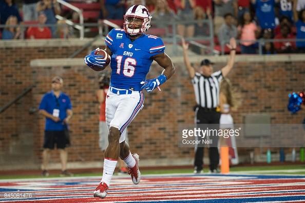 SMU wide receiver Courtland Sutton runs in one of his four touchdowns. Photo credit: Getty Images