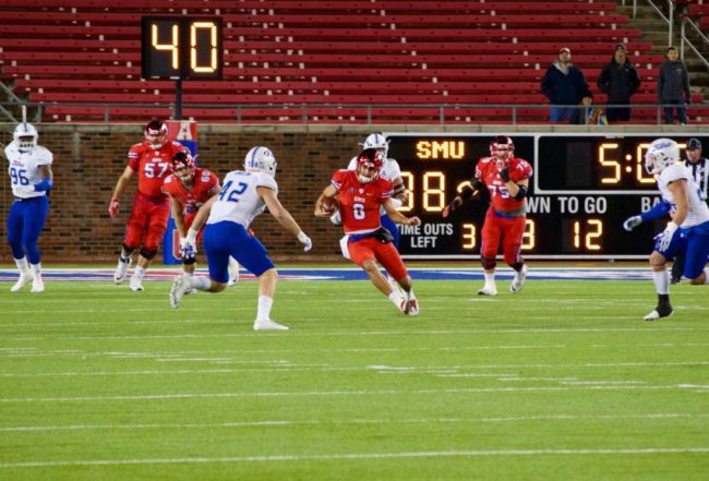 Ben Hicks scrambles for a first down. Photo credit: Shelby Stanfield