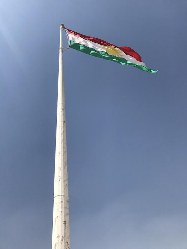 Kurdish flag flying at the memorial to soldiers killed in the fight against ISIS Photo credit: Mazen Barzani