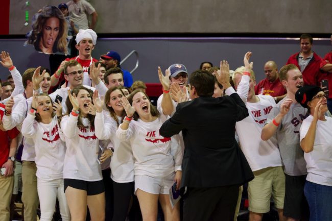 Tim Jankovich high fives fans after SMUs big win over USC. Photo credit: Shelby Stanfield