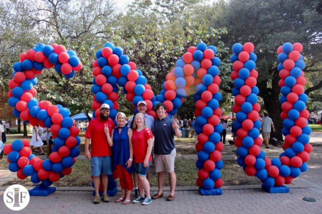 Families pose for a photo at last years Family Weekend balloon attraction on the Boulevard. Courtesy SMU Student Foundation. Photo credit: Photo credit: SMU Student Foundation