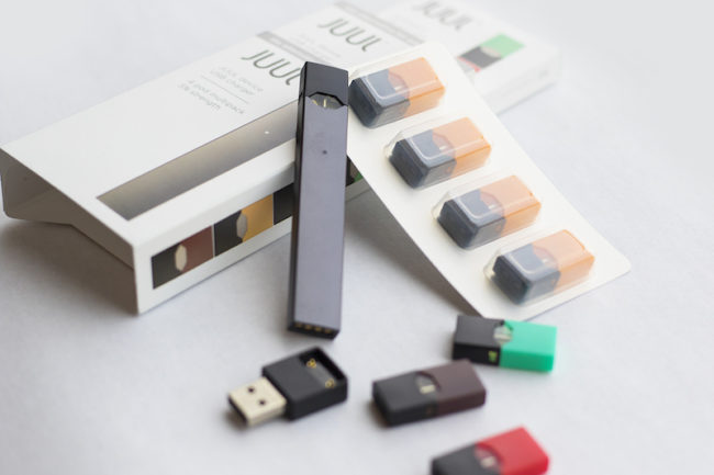 JUUL e-cigarette and pods of various flavors Photo credit: Google Images