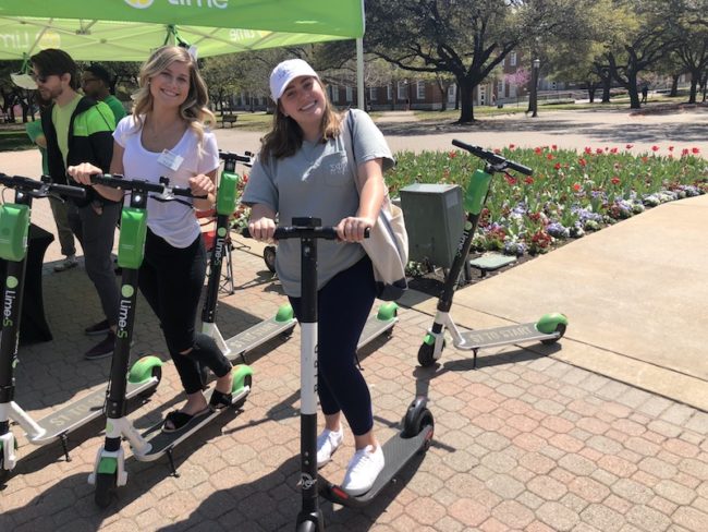 Two SMU students enjoyed test riding Lime and Bird scooters. Photo credit: Carolina Sanchez