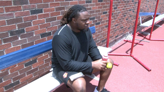 Chris Biggurs eats apple and drinks protein shake after his workout Photo credit: Demerick Gary