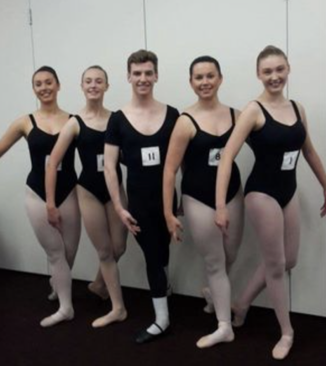 Jarod Murphy, the only male, stands in line prior to his advanced ballet exam.png