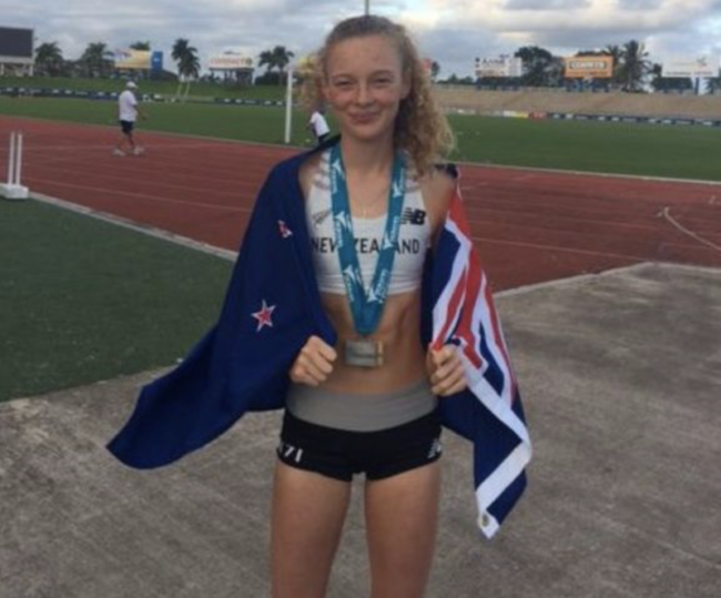 Tessa Webb stands after winning silver at the 2017 Oceania games.png