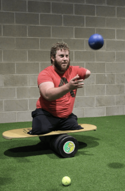 Tyler Turner  juggles while on balance board.png