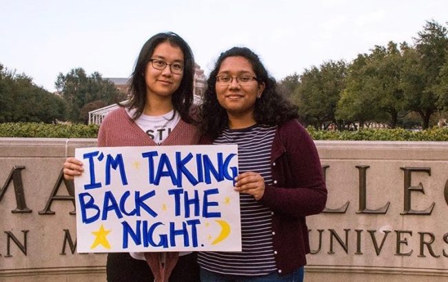 Karen Guan (left) and Lamisa Mustafa hold a sign for FEM’s Take Back the Night in 2018 at Southern Methodist University. Photo credit: SMU Feminist Equality Movement