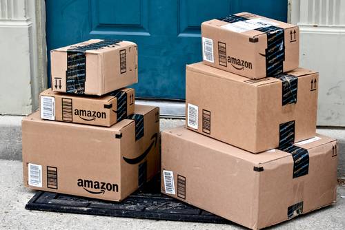 Amazon Prime boxes on a doorstep.