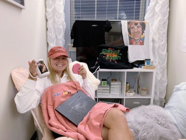 Zimmerman in her dorm with her YouTube merch Photo credit: Audrey Johnson