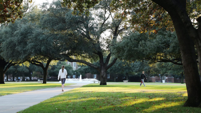 Students walking on Dallas Hall Lawn Photo credit: Asher Thye