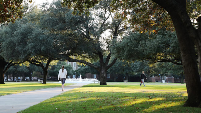 Students walk on Dallas Hall Lawn the week before spring break. Photo credit: Asher Thye
