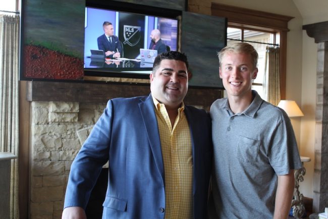 Garrett McLaughlin poses for a photo after being selected as the 8th overall pick of the 2020 NFL Draft.