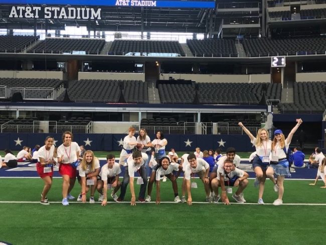 Lexxi posing with the "O-Team" in AT&T Stadium