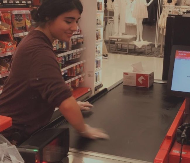 Target Worker disinfects the check lanes