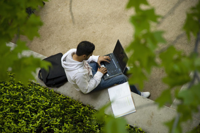A student studies near Cox School of Business. Photo credit: SMU