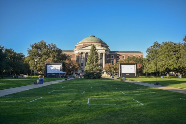 Dallas Hall Lawn being prepared for the Celebration of Lights. White paint on the grass designates pods to maintain social distancing. Photo credit: Saifiyah Zaki