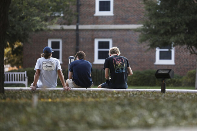 SMU students sit outside on campus. Photo credit: Ash Thye