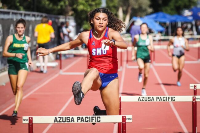 Woods+jumping+a+hurdle+in+the+middle+of+a+400m+sprint.+Photo+credit%3A+SMU+Track+%26+Field