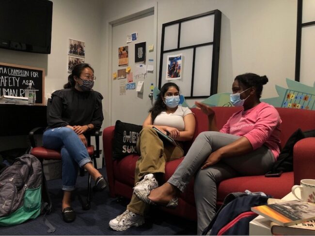 Left  to Right: Johanna Pang, Lamisa Ali and Bethany Bass discuss plans for Homecoming week in Southern Methodist University’s Human Rights Council (HRC) office. Pang and Bass will represent the HRC as candidates for Homecoming Royalty. Photo credit: Sydney Sagehorn
