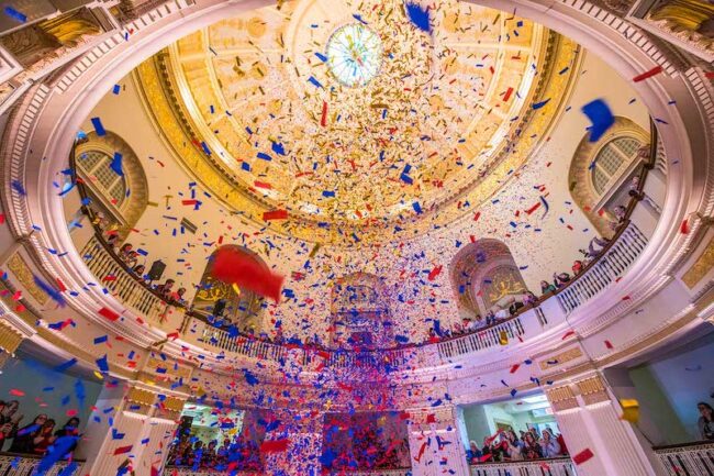 Celebratory confetti comes down from the dome of Dallas Hall. Photo credit: SMU