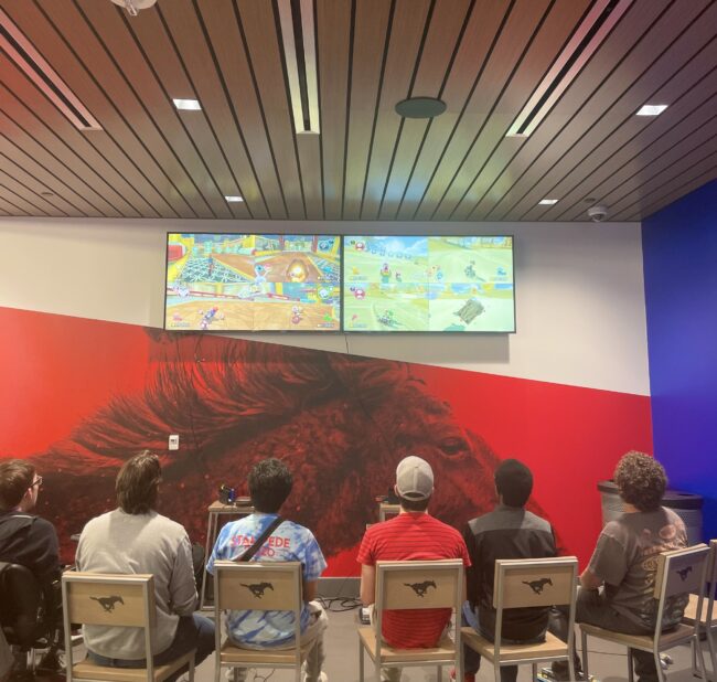 Members relax and enjoy time together while enjoying a little healthy competition of Mario Kart. Photo credit: MT Charlebois