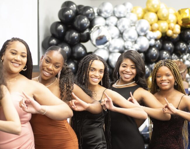 Members of the Kappa Mu chapter of Alpha Kappa Alpha, one of SMUs all-Black sororities, pose by the photo booth backdrop. Image Credit: Emma McRae