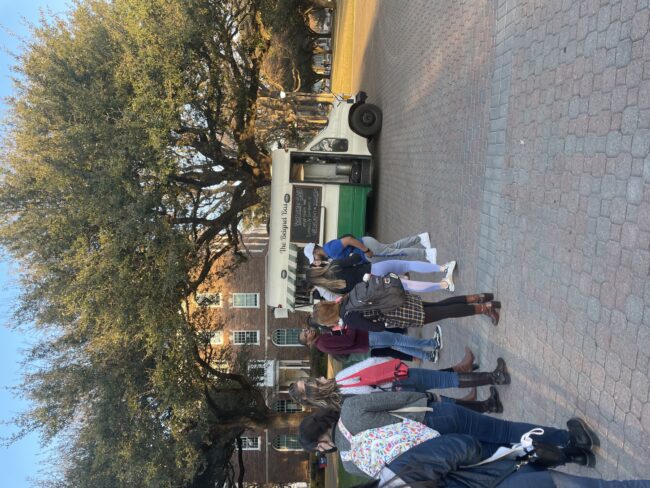 Student line up to get beignets at the VSA French Garden Event