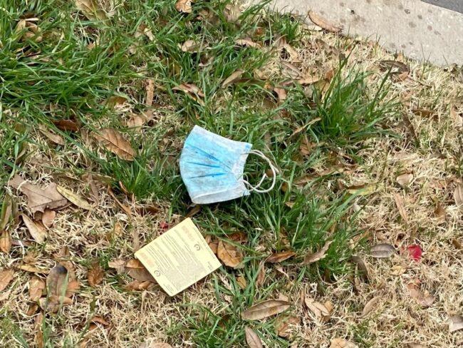 An old mask found on the grass of SMU's campus. Photo credit: Lauren Ewing