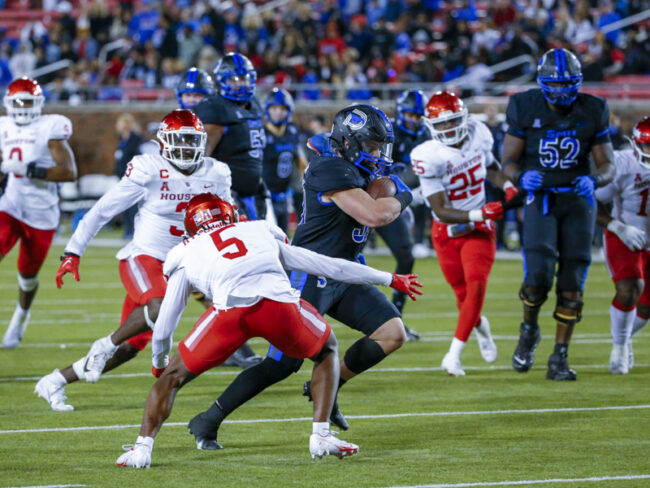 SMUs Tyler Lavine rushes into the Houston redzone in an NCAA match at the Gerald Ford Stadium in Dallas. Photo credit: Mark Reese