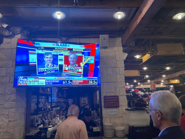 Voters watch as Fox News calls the race for Governor Abbott.
