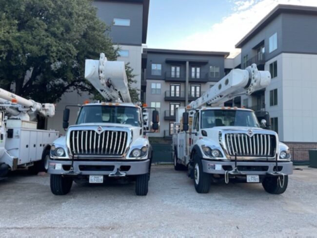 ONCOR technical vehicles are parked outside apartments near SMU’s campus Tuesday, during a power outage. Photo credit: Kirk Ogunrinde