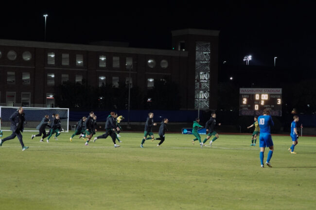 Vermont players celebrate while SMU players look on dejected as the final whistle sounds. Photo credit: Rylan Robb