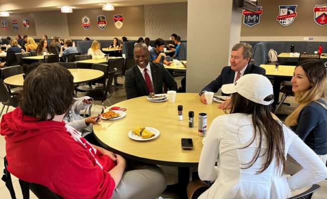President Turner and Vice President for Student Affairs, Dr. Mmeje, eats lunch with four students in Umphrey Lee Dining Hall on Nov. 2, 2022. Photo credit: Jordyn Harrell