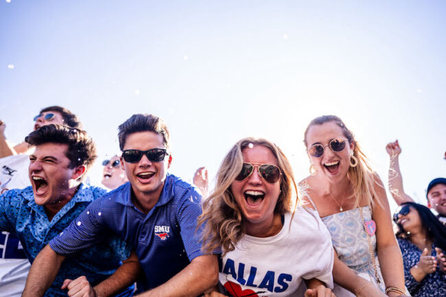 Claire Schmidt, SMU senior, third from left, cheers on the Mustangs from the front of the student section at Gerald J. Ford Stadium in Dallas, Texas on Sept. 24, 2022. (©2022 Ella McDonald/SMU) Photo credit: Ella McDonald