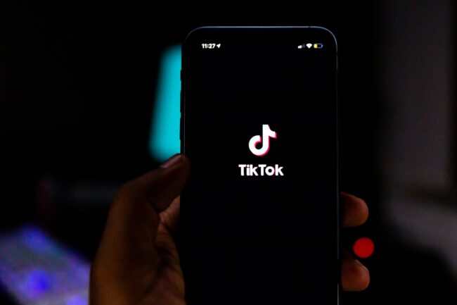 Tik Tok logo on phone by Solen Feyissa is licensed under CC BY-SA 2.0. https://creativecommons.org/licenses/by-sa/2.0/?ref=openverse.