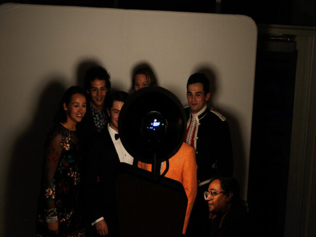 Students use the Photo Booth at PC's Gilded Gala event.