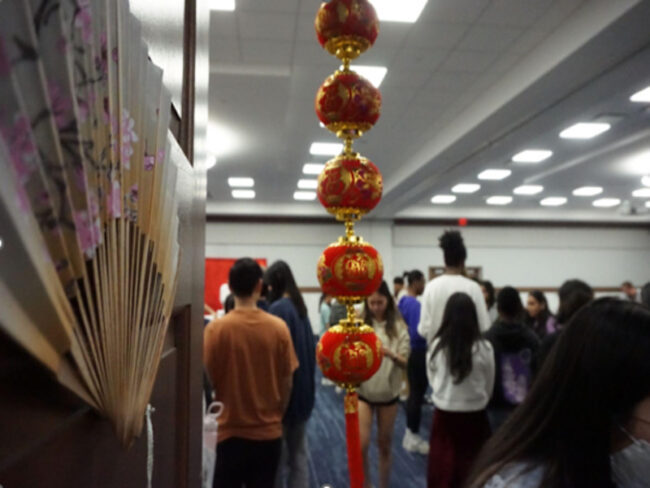 Red Chinese lanterns hang at the entrance of the Hong Kong Night Market. Photo credit: Soksan Teng