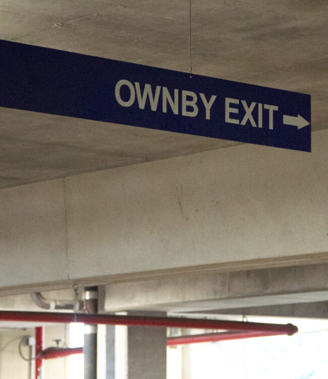 Ownby Drive is currently an unmarked street running along the West side of Ford Stadium. The street sign is no longer standing, likely due to construction, but a sign in Binkley Parking Garage marks an exit to Ownby Drive.