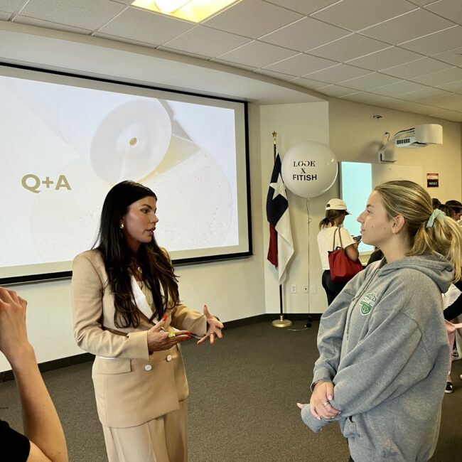 Founder of Fitish, Jenna Owens, speaks with an SMU student after her lecture.