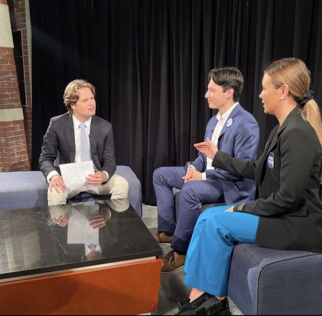 Hilltop Nows Peter Warner sits down with student senate presidential candidates Alex Alarcón and Hope Heiden in the news studio. Image courtesy of @hilltopnow on Instagram.