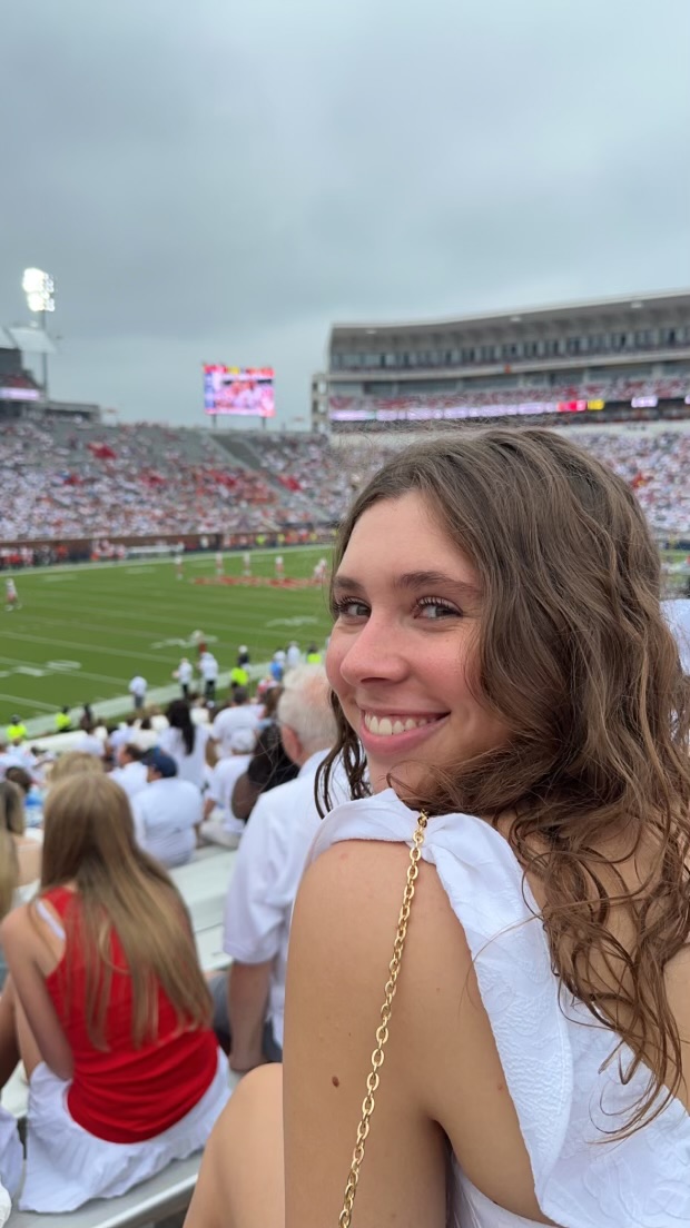 Honor Wallace enjoys a football game.  