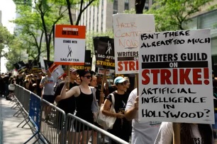 Morgan Draper, seen here holding a SAG-AFTRA sign, joined the picket line this past summer to show her support for the strikes.