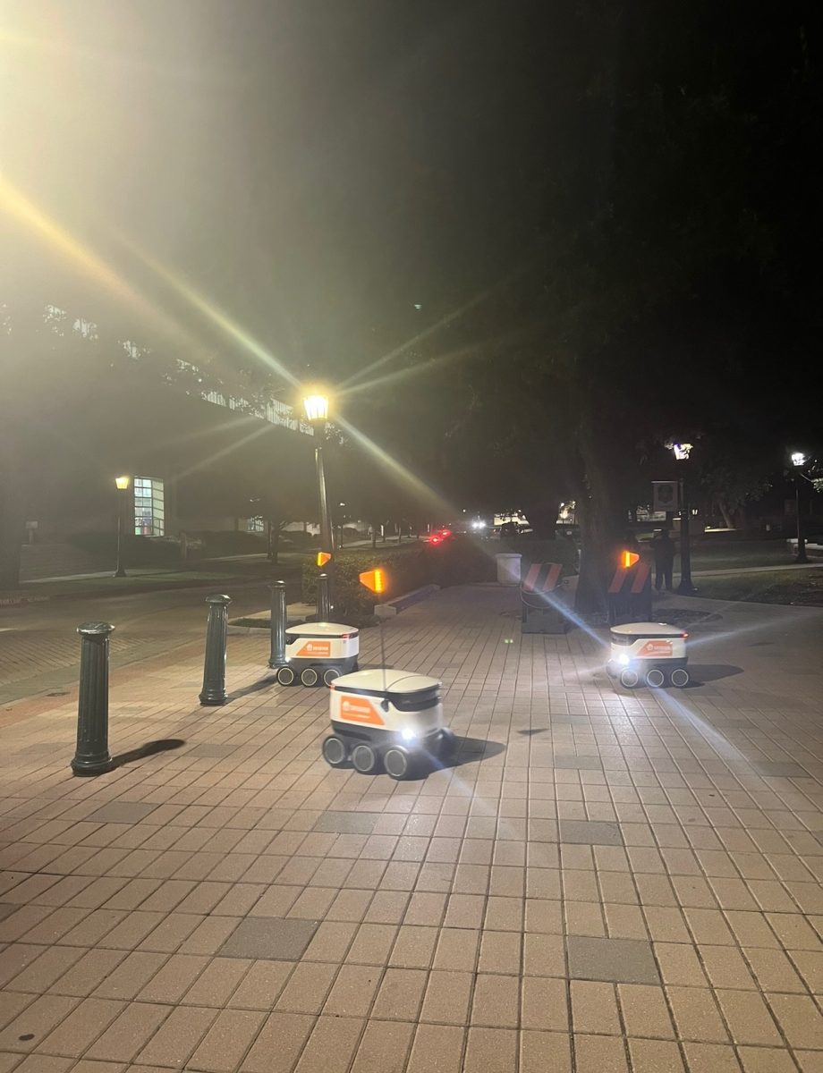 Starship robots congregate on campus at night.