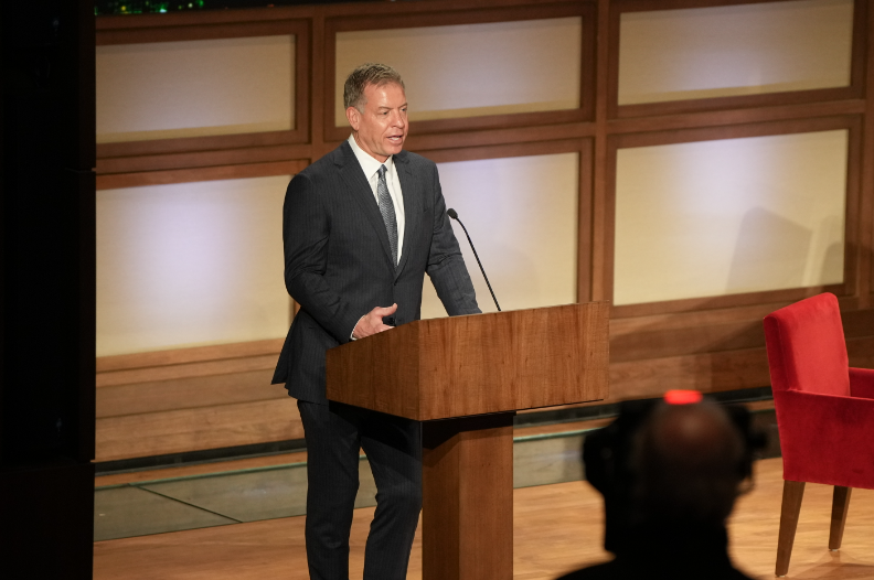 Football Hall of Fame member and former Dallas Cowboy Troy Aikman gives opening remarks at the Bush Center on SMUs campus before introducing host Ade Madkour.