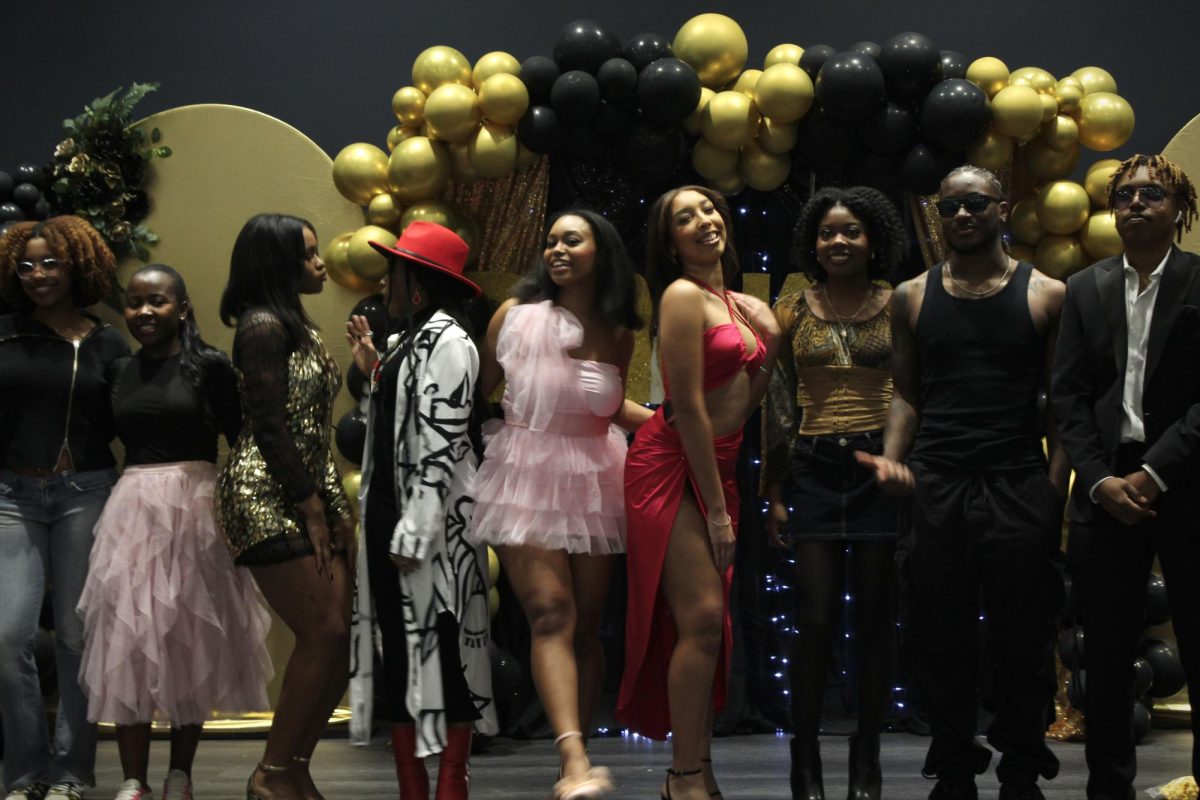 The Association of Black Students at SMU presents a fashion show on Friday, Feb. 16, 2024 in Dallas, Texas. The students in the fashion show smile as the event comes to an end.  