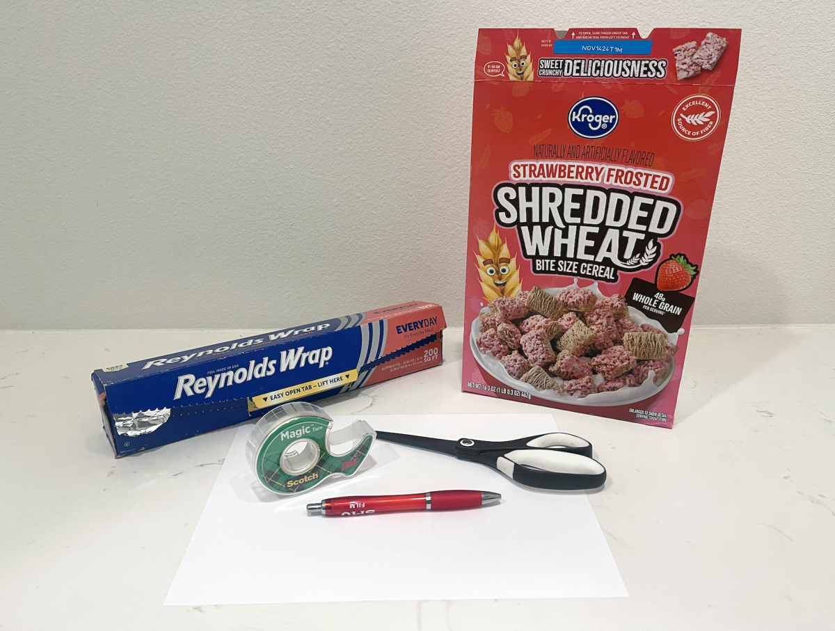 1. You will need: a cereal box, a white piece of paper, scissors, tape, aluminum foil and a pen.