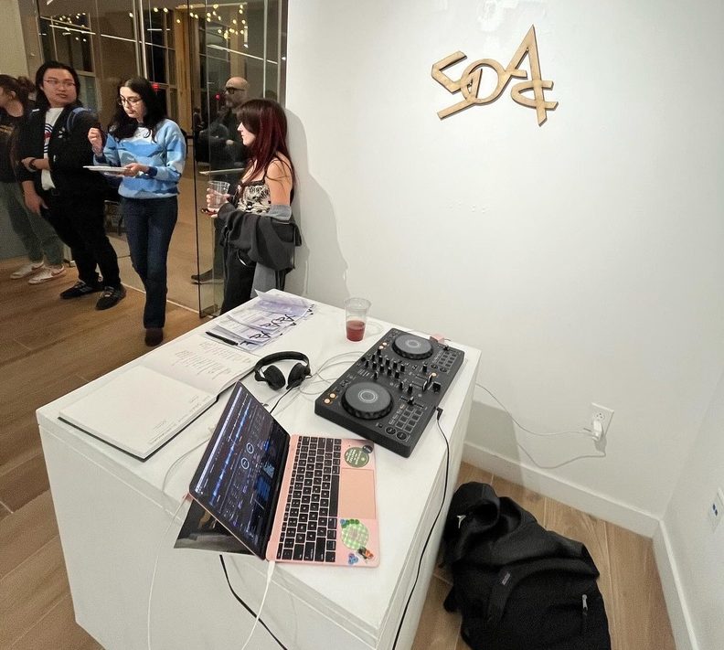 Capri Woss's DJ set up at a student art exhibit.