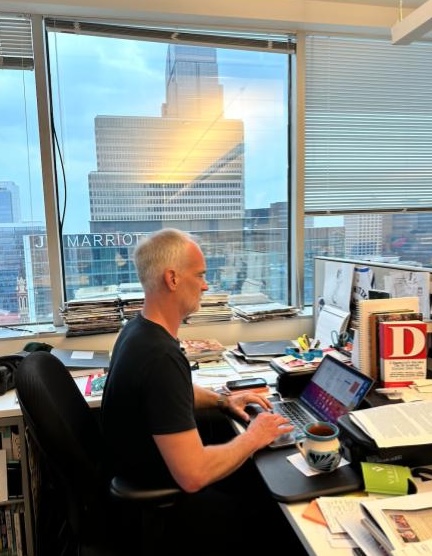 Zac Crain working at his desk at D Magazine. 