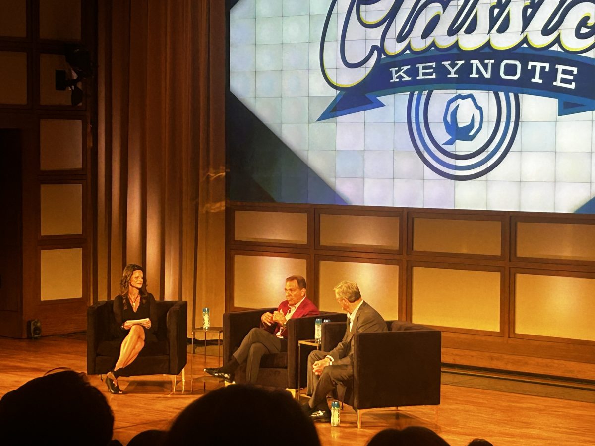 Heather Dinich (left), Nick Saban (center) and Charlie Baker (right) engaged in conversation . Dallas, September 17, 2024. (Photo/Mikaila Neverson).